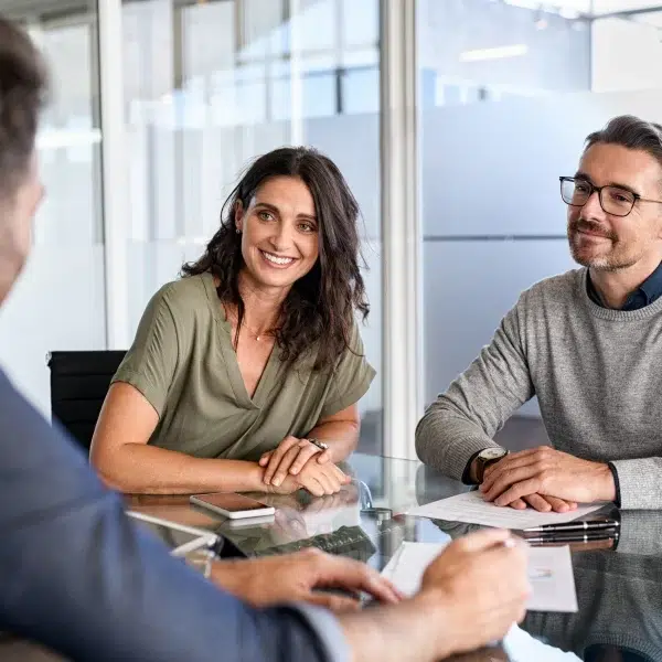 Men and a woman hearing a man